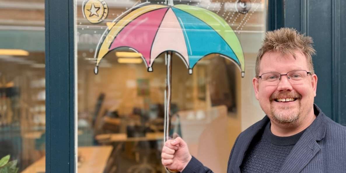 ASCENTANT ACCOUNTANCY ripley ALL DONE – Pictoria-6 Kevin stood outside the Ripley office, pretending to hold the umbrella painted on our shop window.