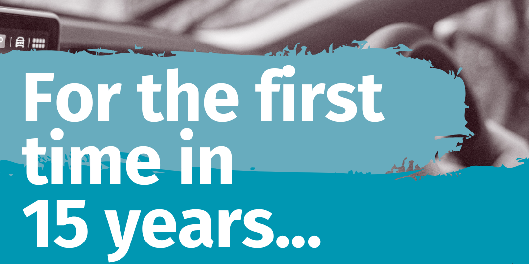 Mileage rate increase Graphic saying 'For the first time in 15 years' with a black and white image of someone driving a car in the background