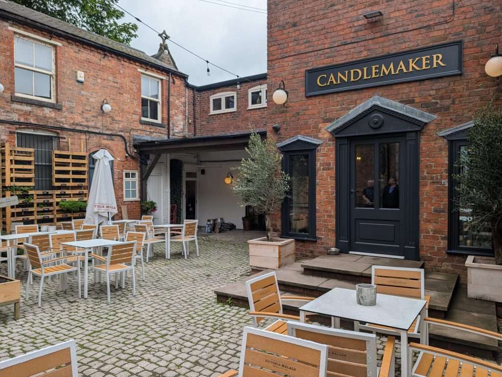 A picture of Candlemaker cafe external seating in a courtyard area.