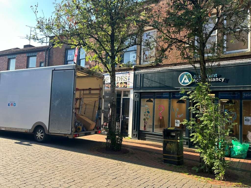 Photo of the outside of our old office with the removal van outside 