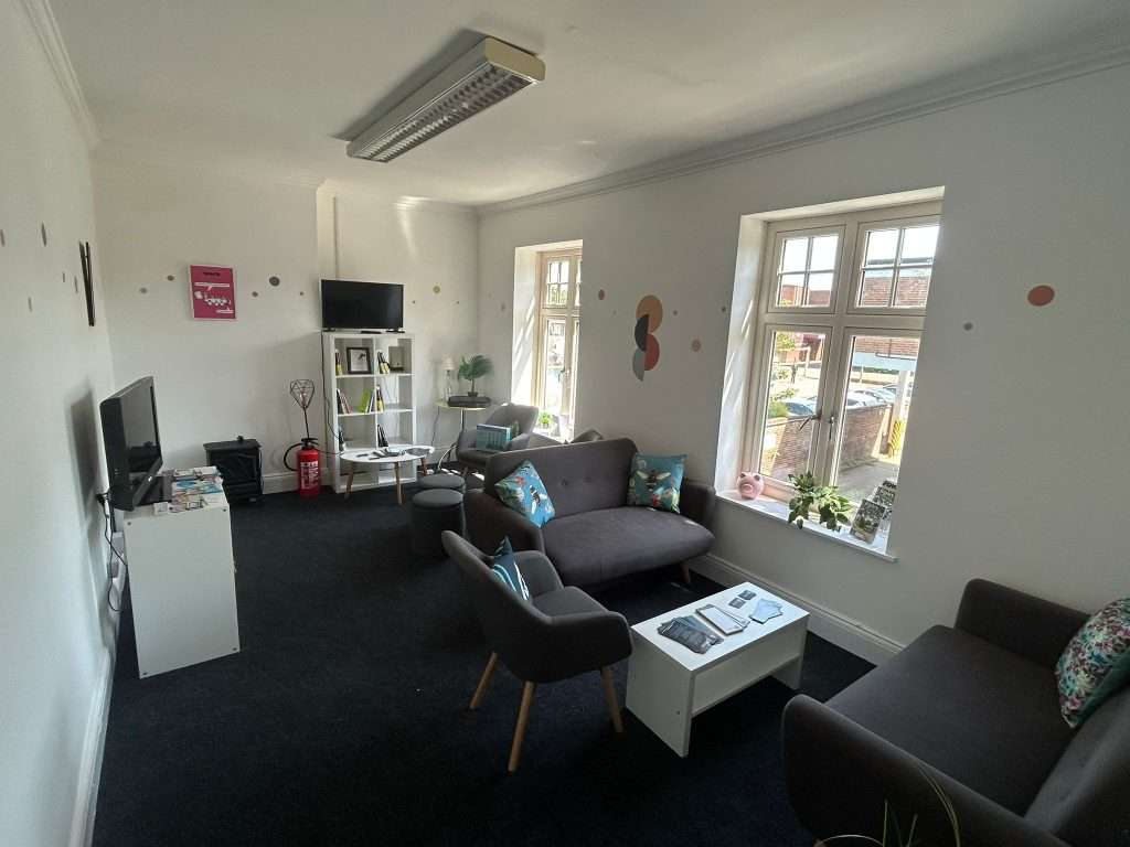 Photo of our new office business lounge with comfy sofas and coffee tables 